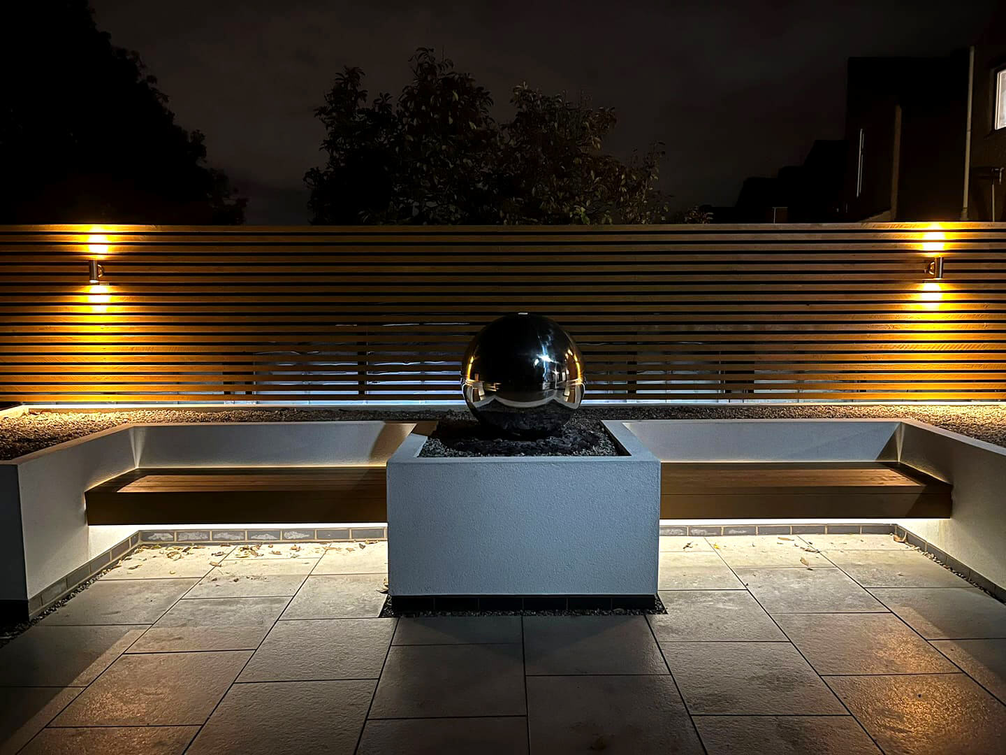 Garden Design Lighting with Raised Borders and Seating Area
