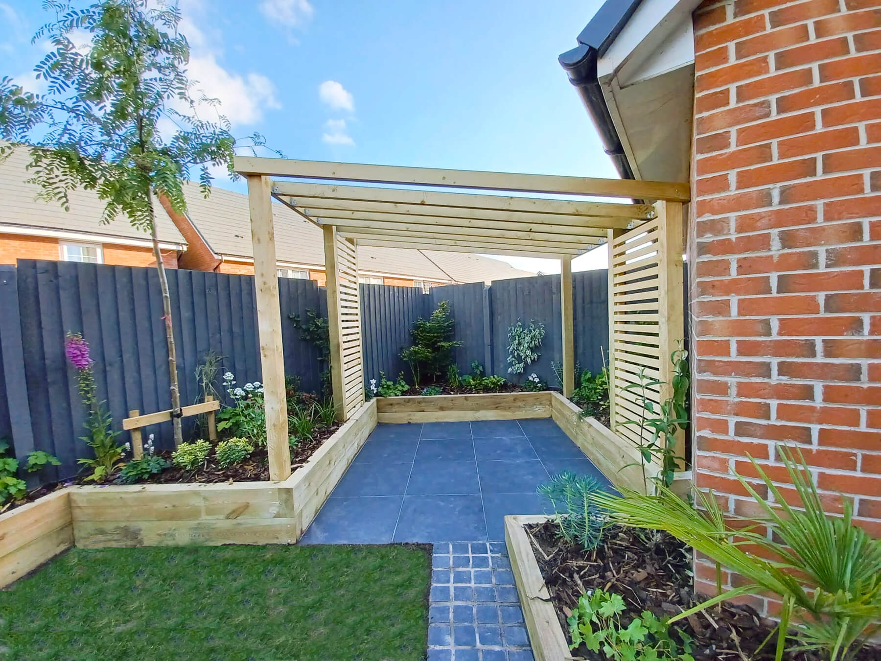 Garden Design with Natural Stone Paving and Pergola