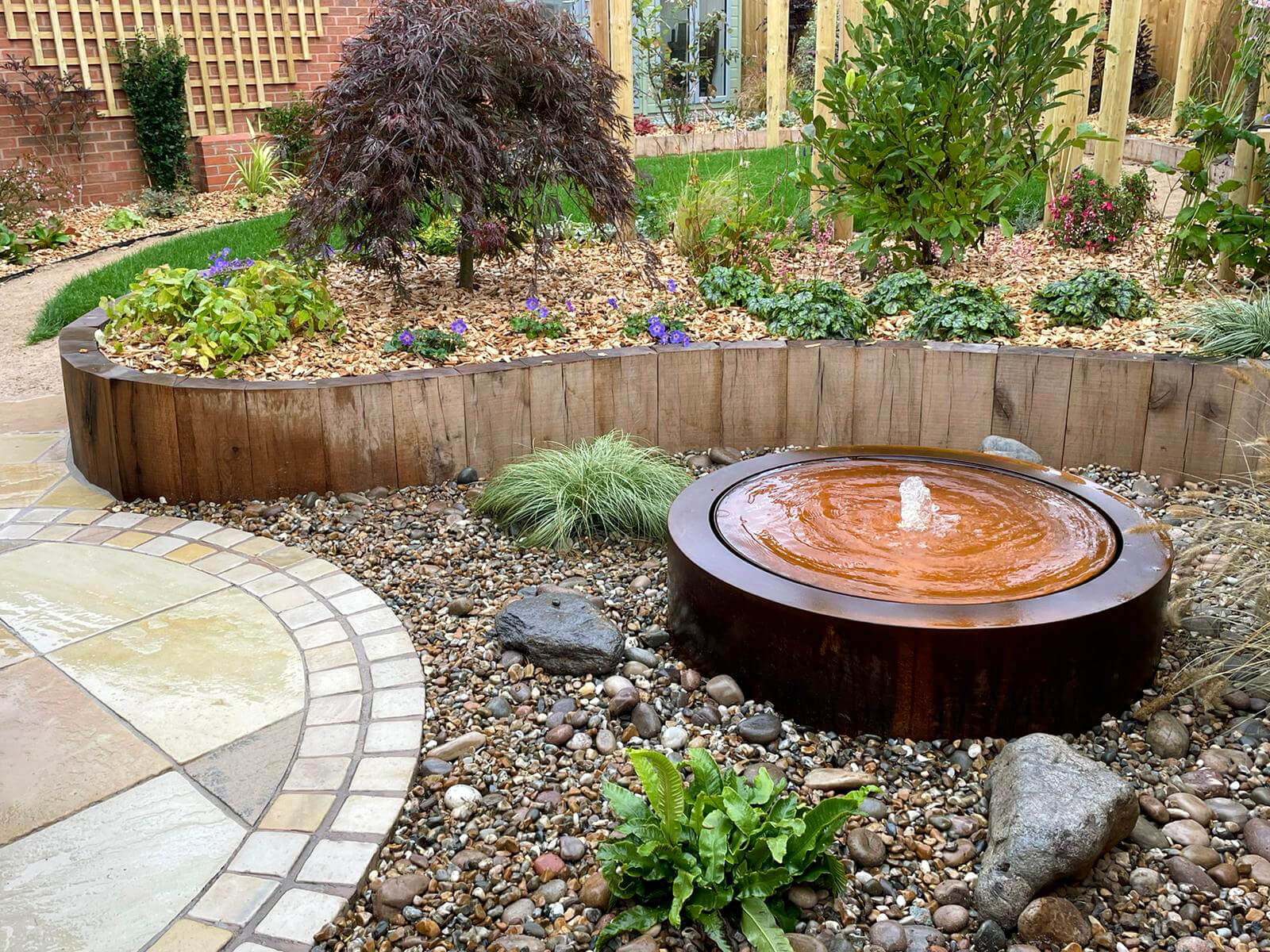 Garden Design with Water Feature and Raised Planting Area
