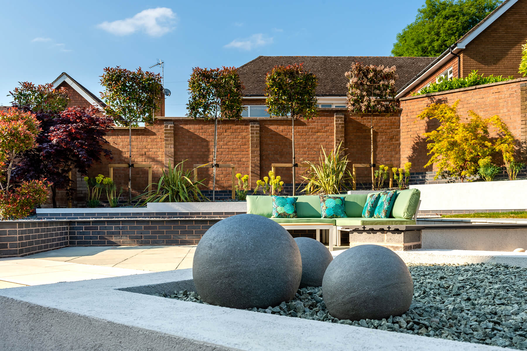 Garden Design with Raised Seating Area and Raised Borders