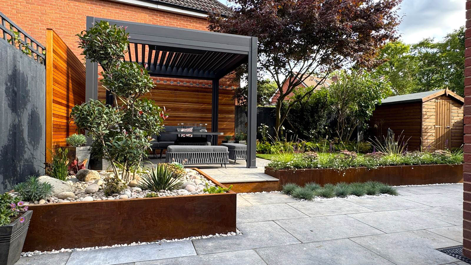 Garden Design with Raised Borders and Patio Area