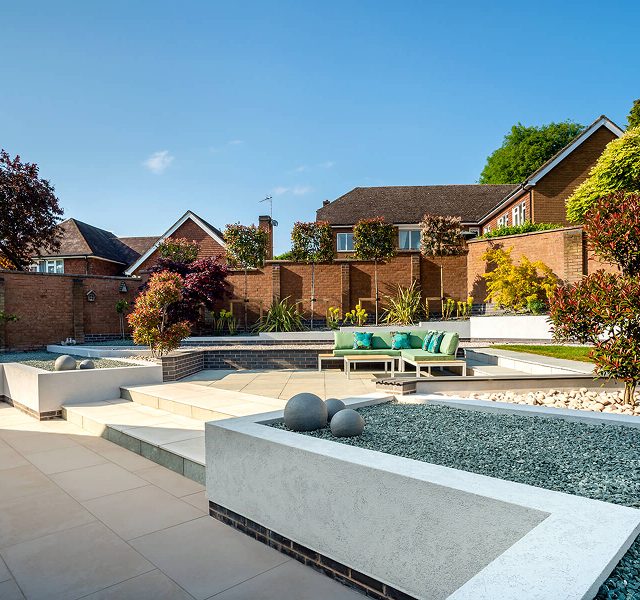 Contemporary garden with lighting and modern paving design
