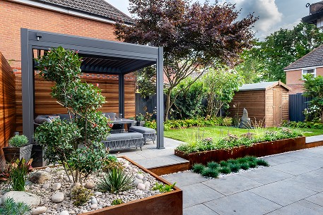 Completed garden landscaping project with lawn and patio
